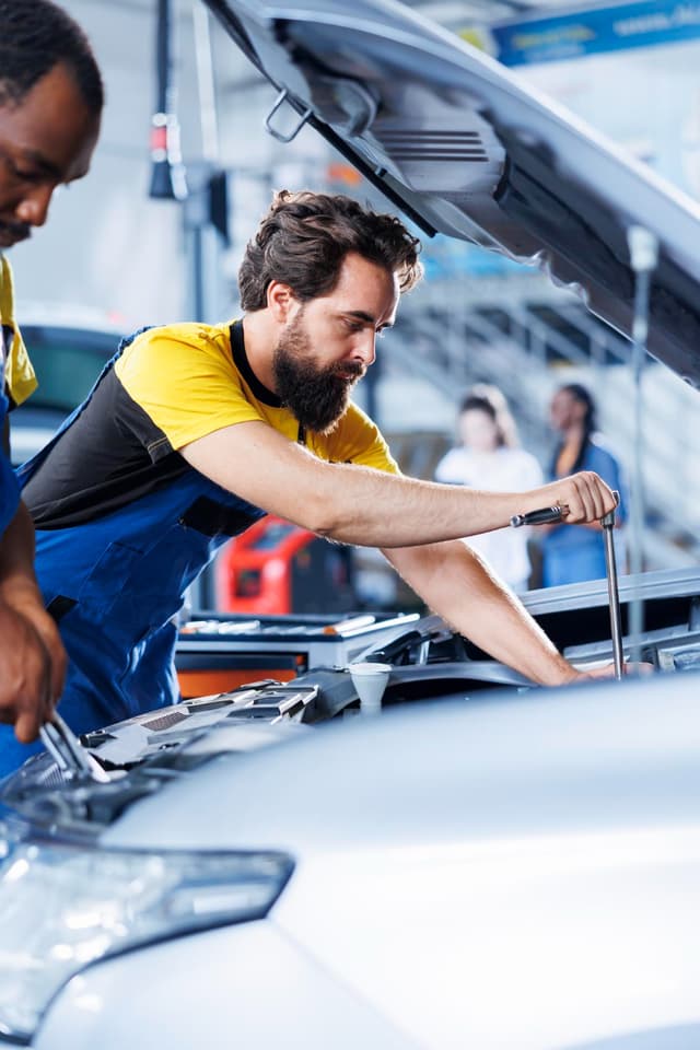 Mechanic working on car
